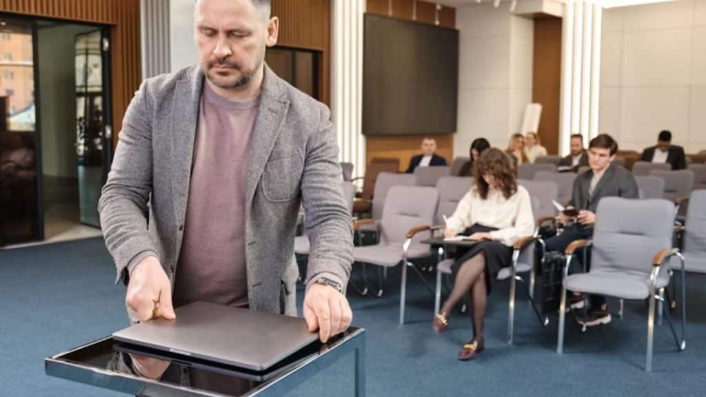 Man appearing tense and thoughtful in a meeting.