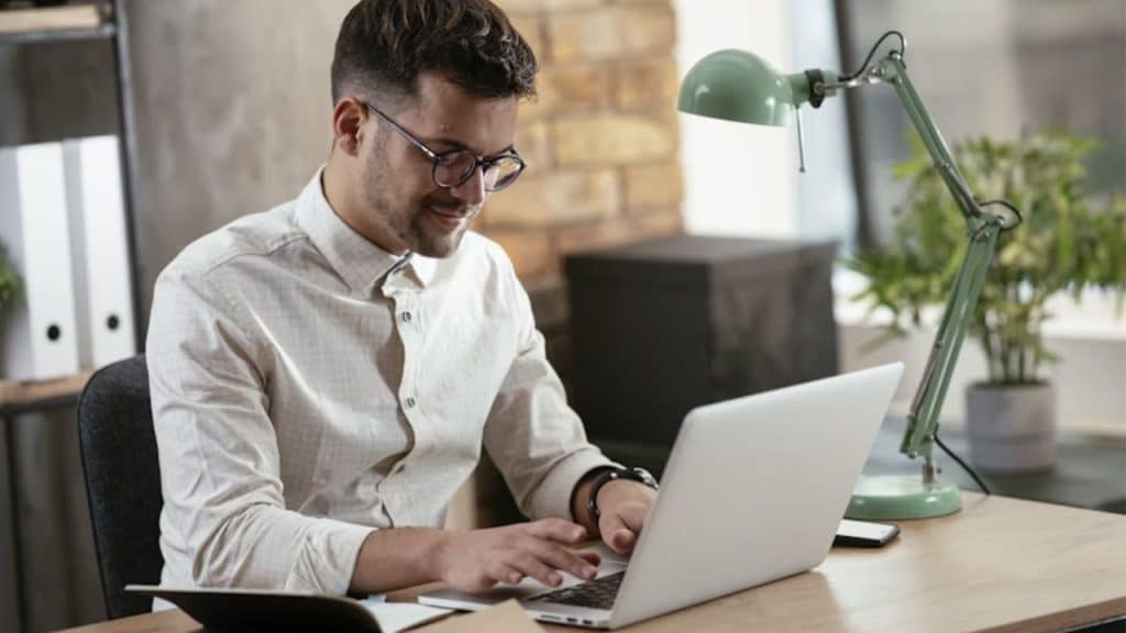 Professional man focusing on his on his laptop.