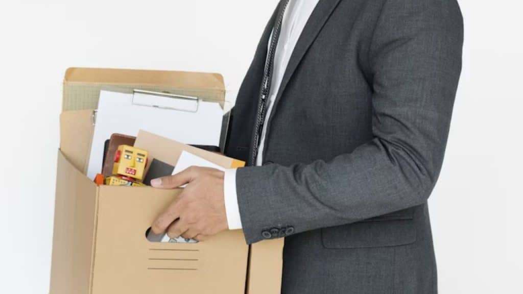 Man packing his desk or preparing for a new opportunity.