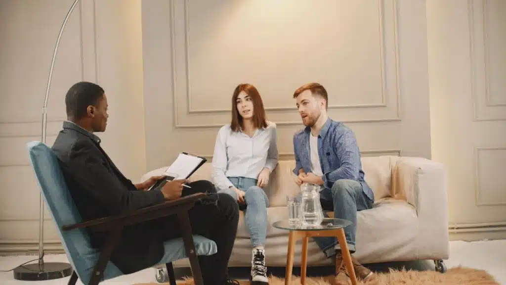 Financial advisor discussing budgeting strategies with a couple.