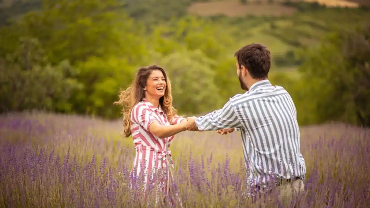 Couple having fun on lavender field.