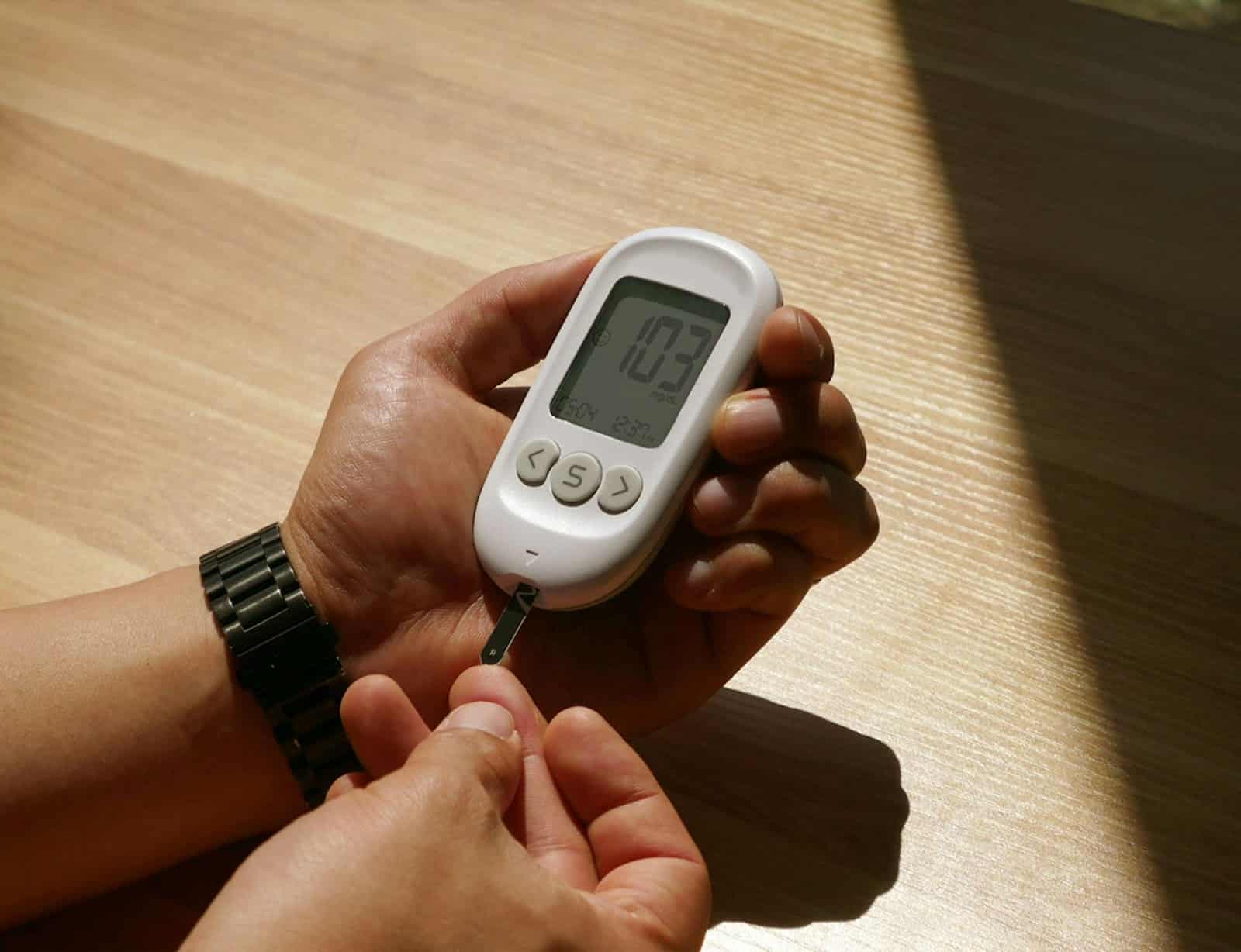 A man checking his sugar level.