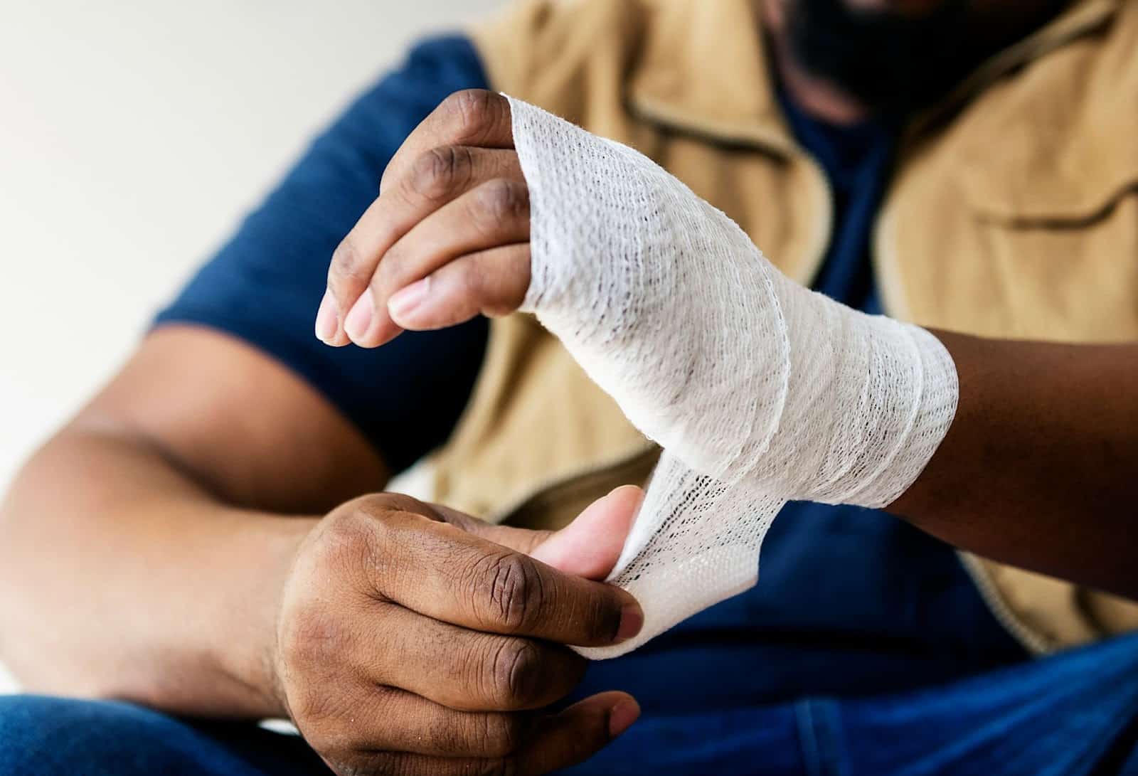 A man with a gauze in his hand.