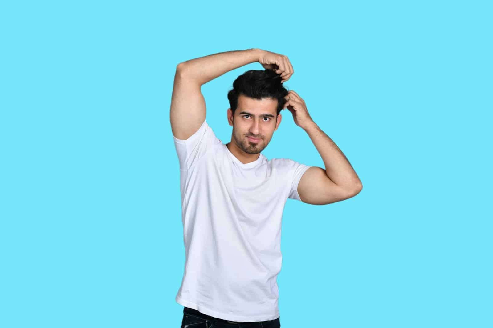 A man showing his armpit.