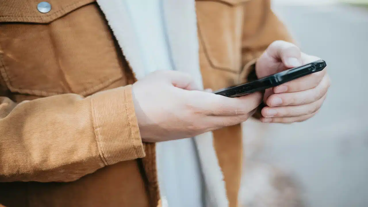 A person using their cellphone.