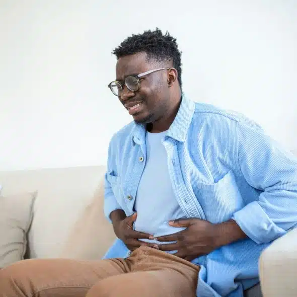 A man holding his tummy