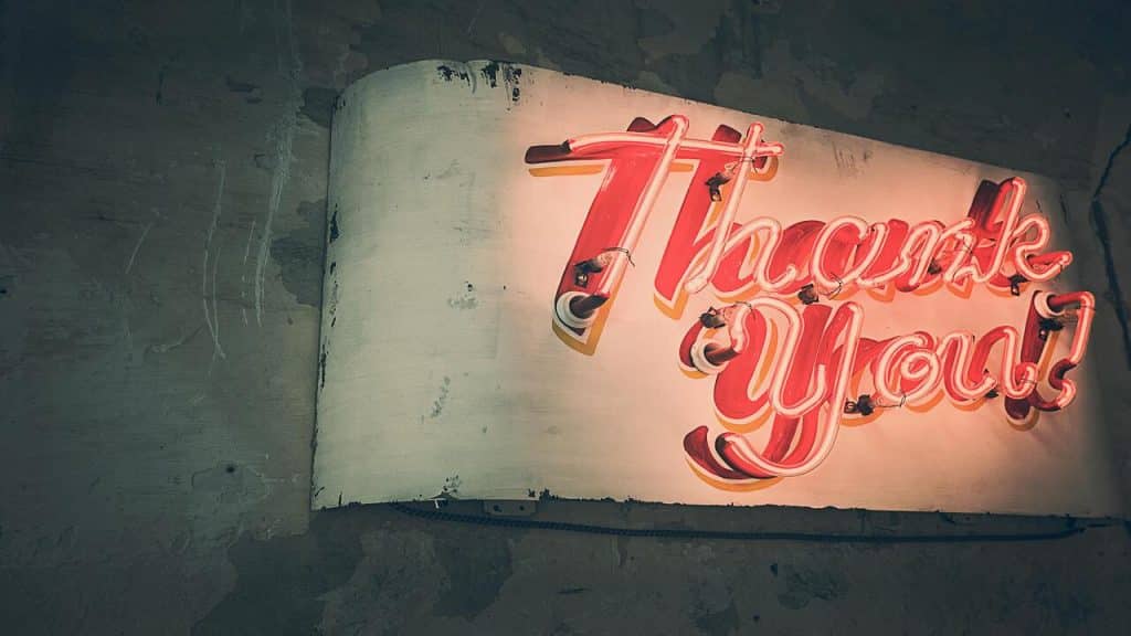 A neon light saying “thank you”.