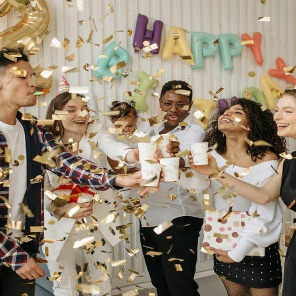 A group of friends celebrating a baby’s birthday.