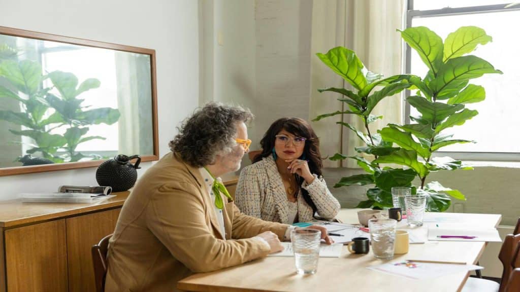 Two colleagues talking in the office.