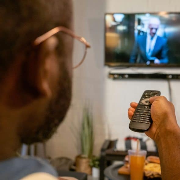 A man watching a tv.