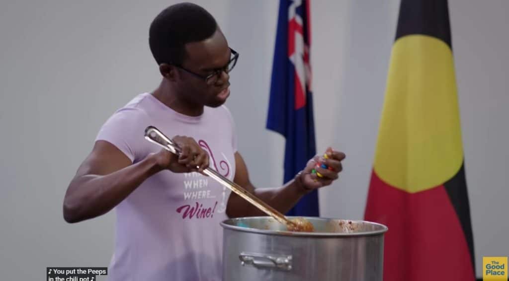 A picture of chidi cooking something.