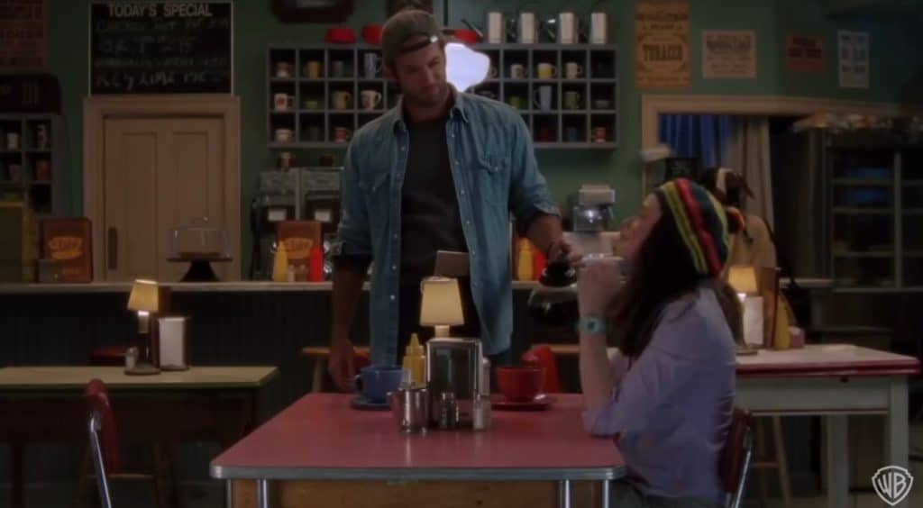 A Picture of Luke Danes talking to a woman.