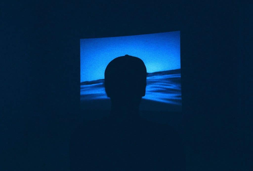 A picture of a man watching.