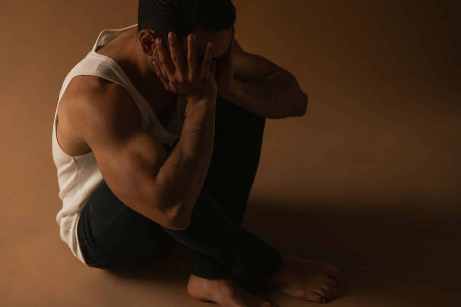 A man covering his ears.
