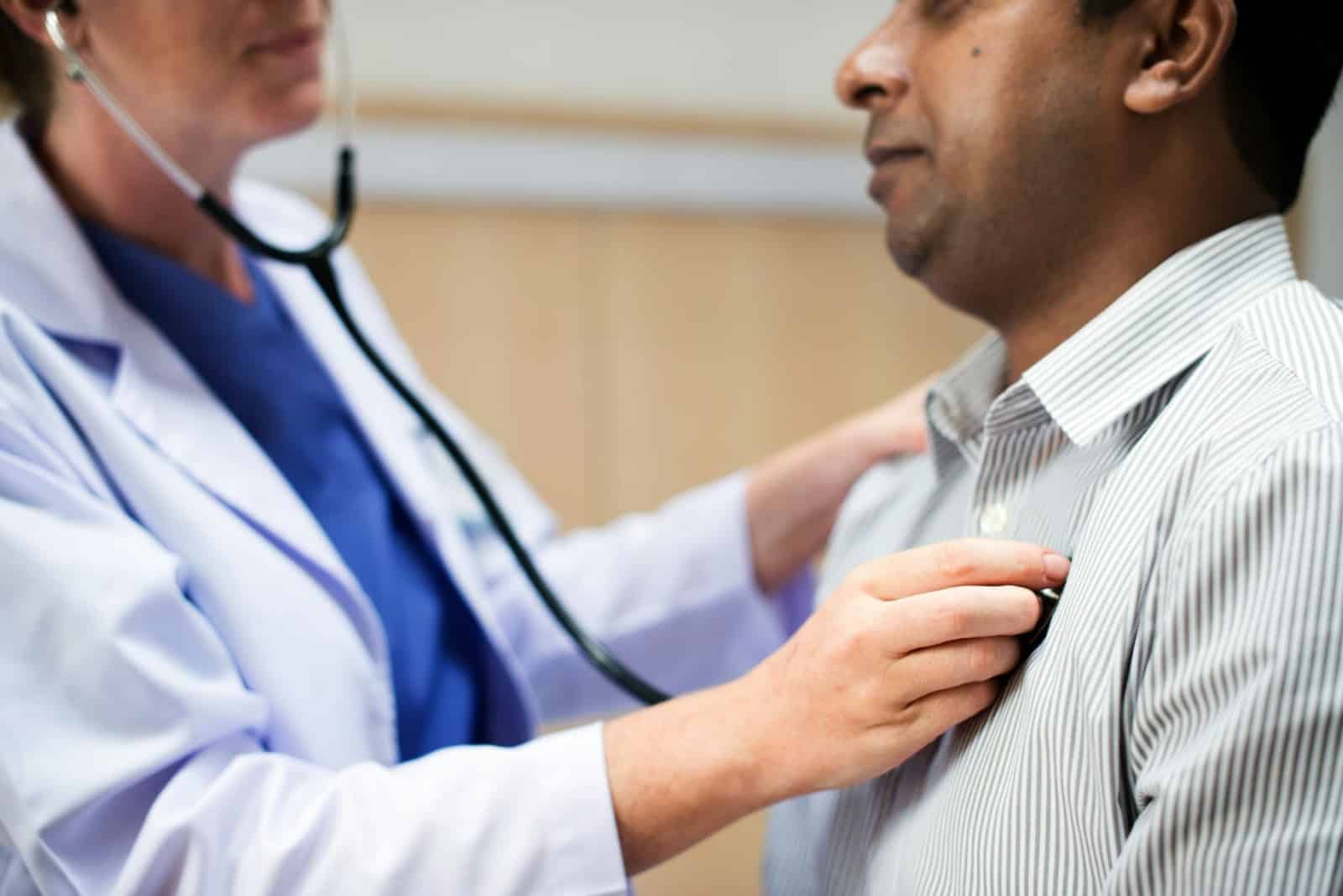 A picture of a man getting a check-up.