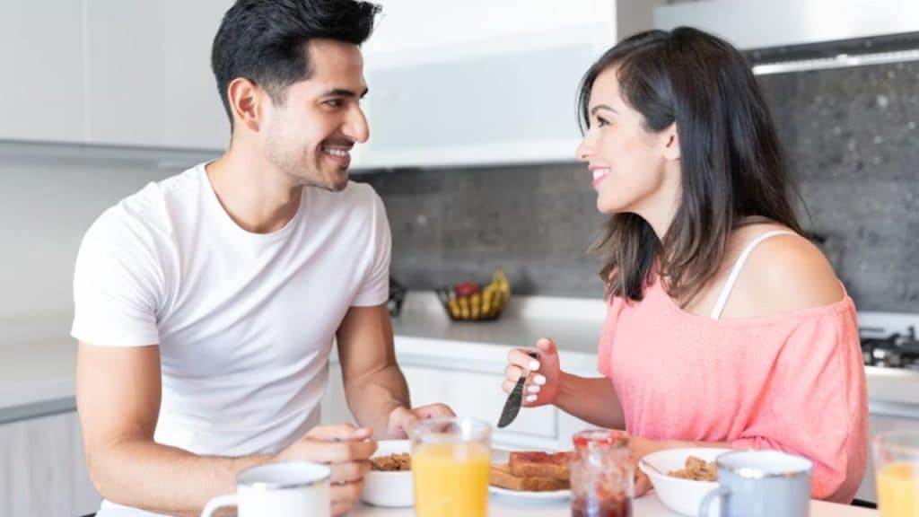 Man gazing at his wife with affection during a quiet morning moment