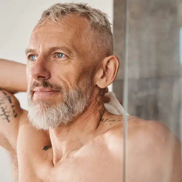 A man in the bathroom.
