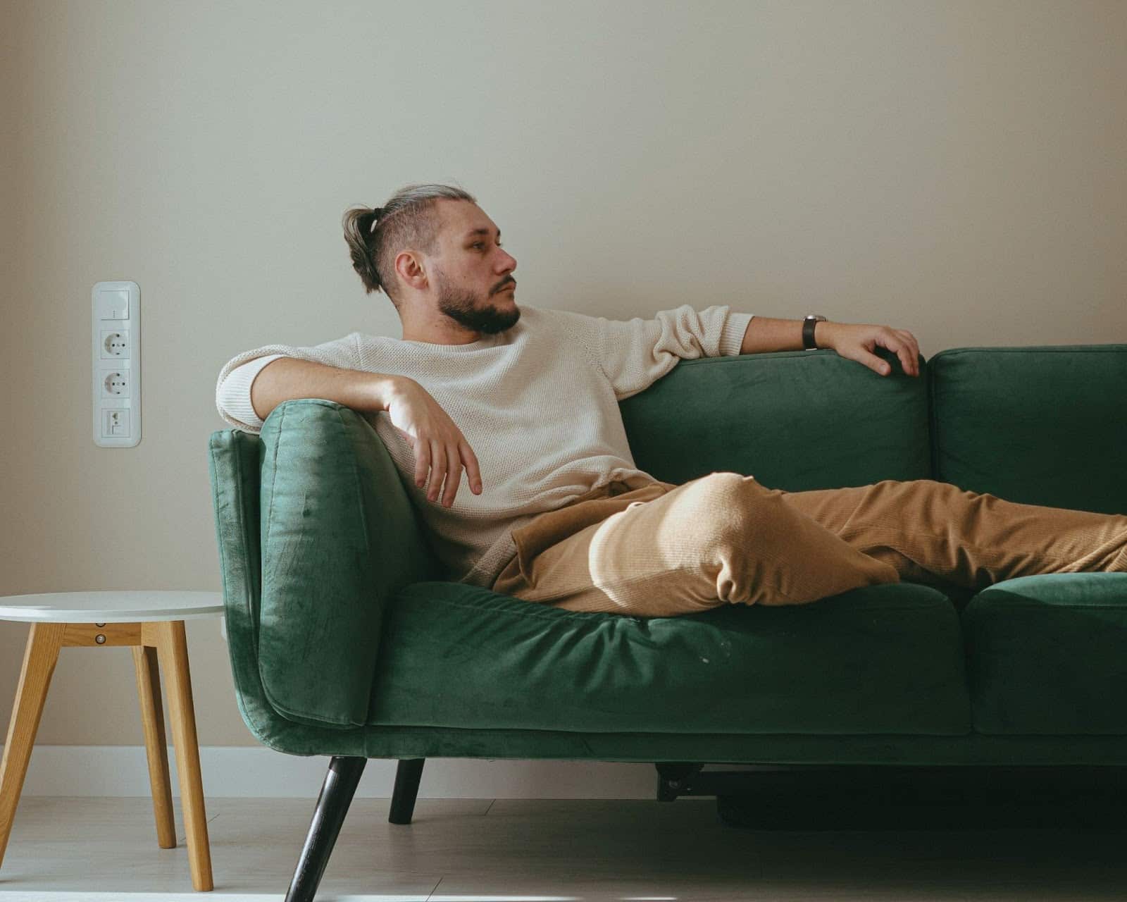 A man chilling on the sofa.