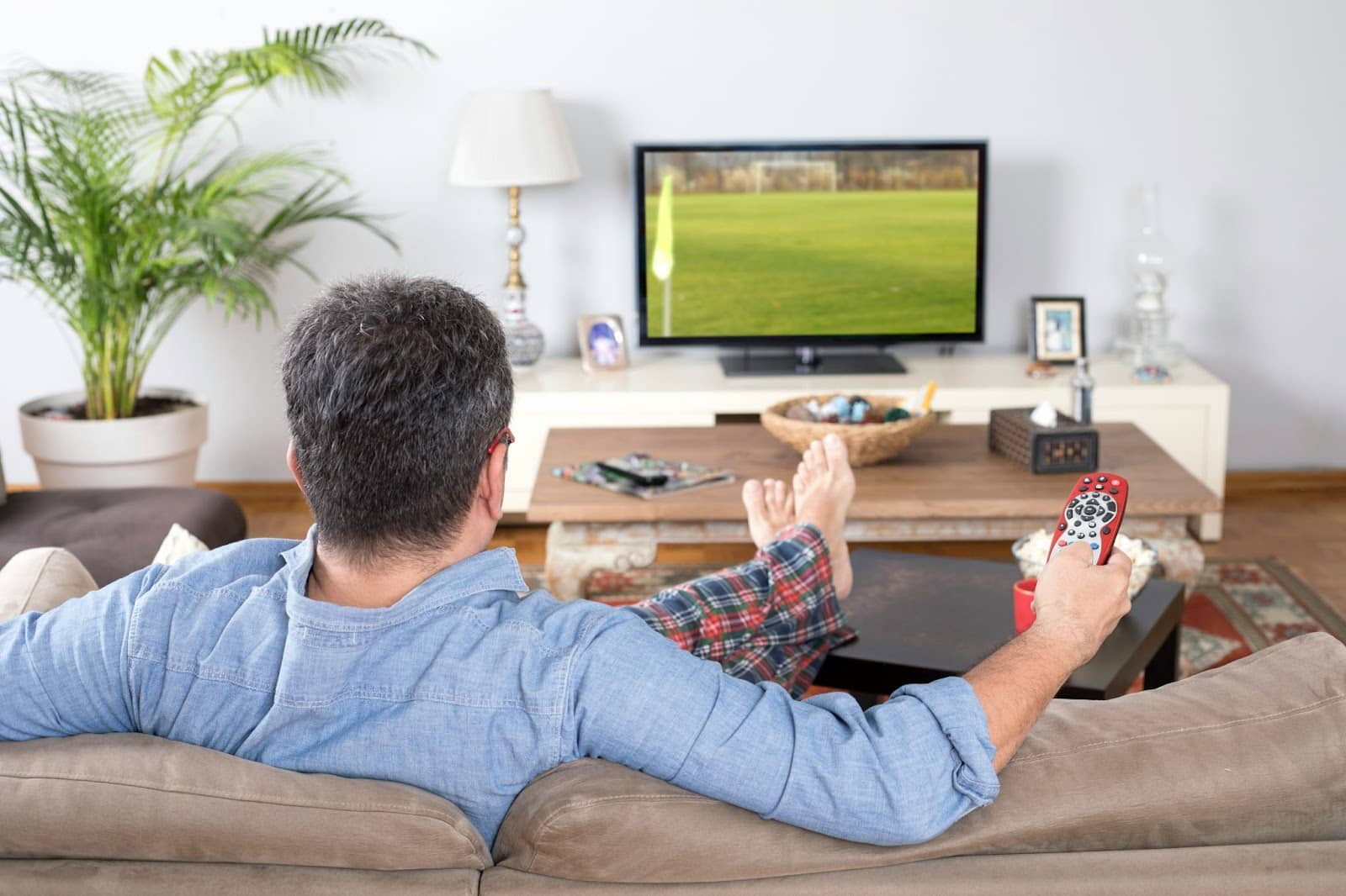 A man just watching tv.