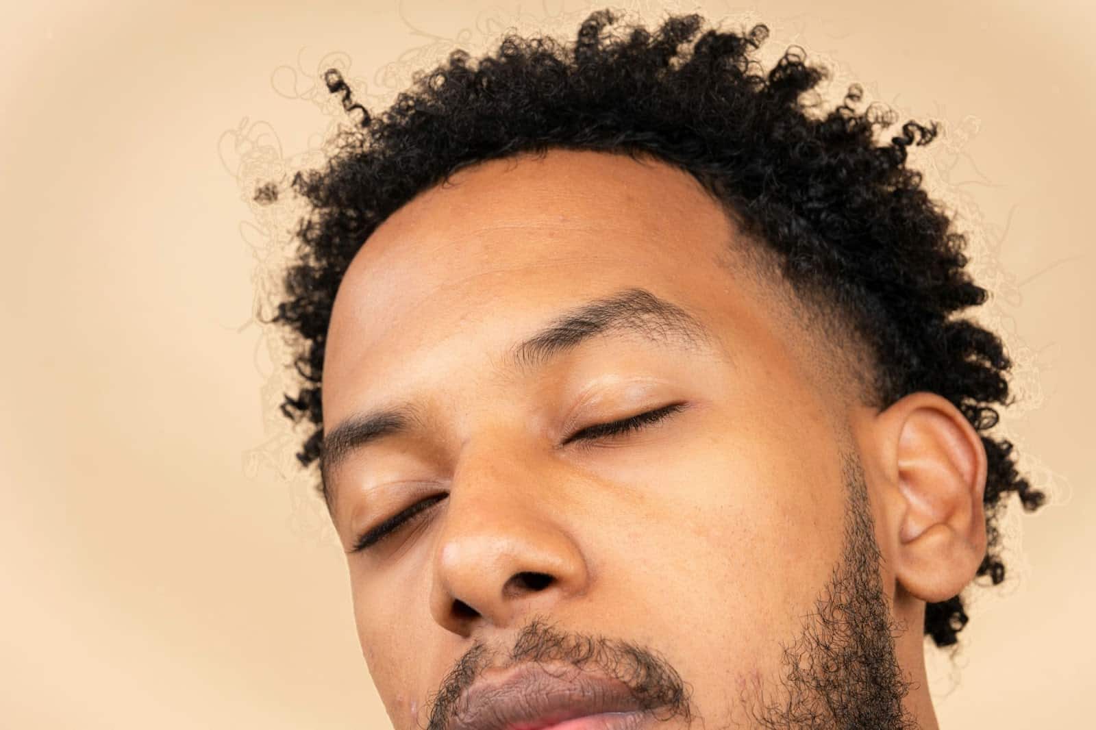 A close-up picture of a person including his nose and ears.