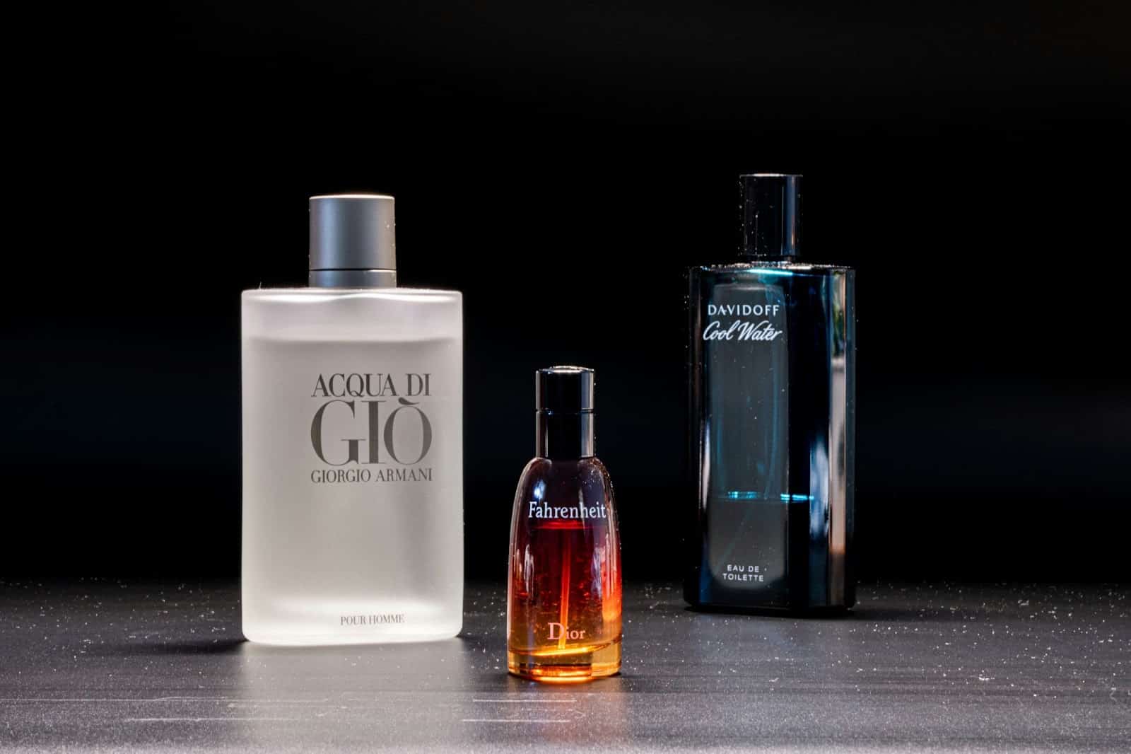 A picture of three bottles of perfume.