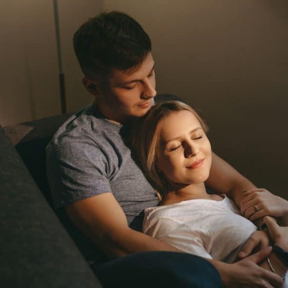 A man hugging a woman