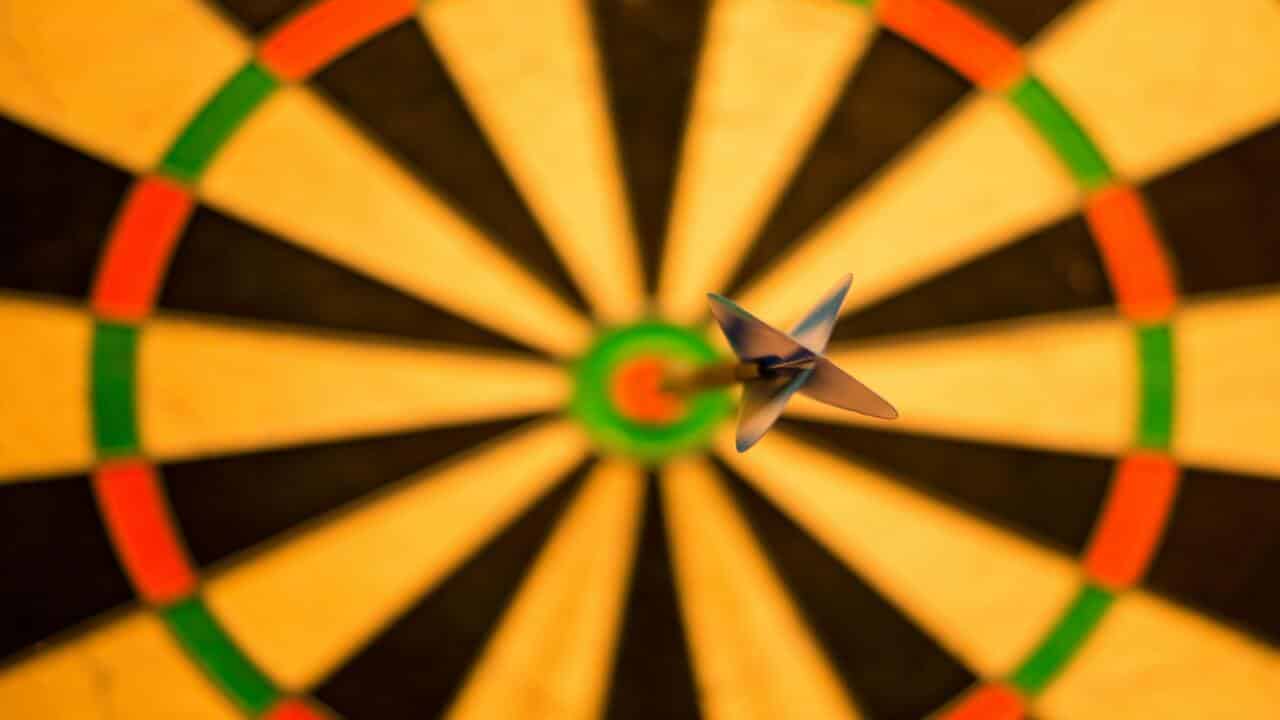 A dart hitting the center.