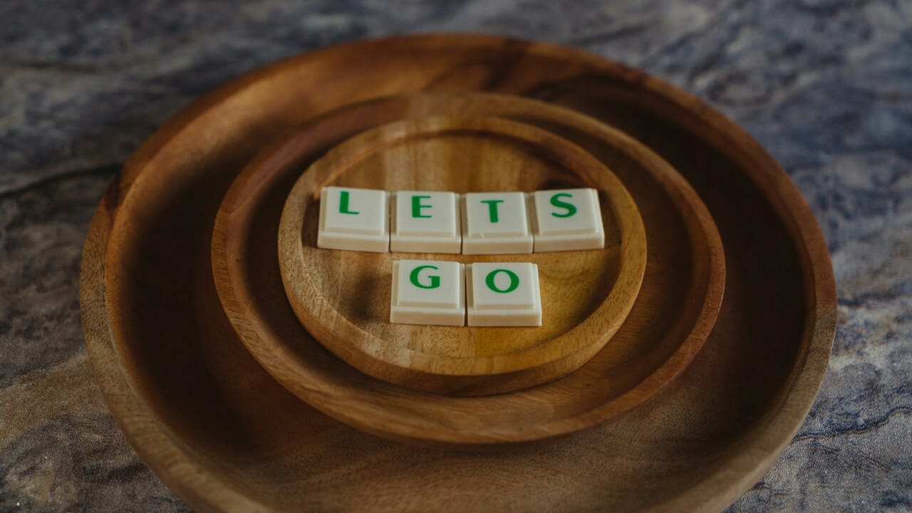 Game pieces spelling out the word “let’s go”.