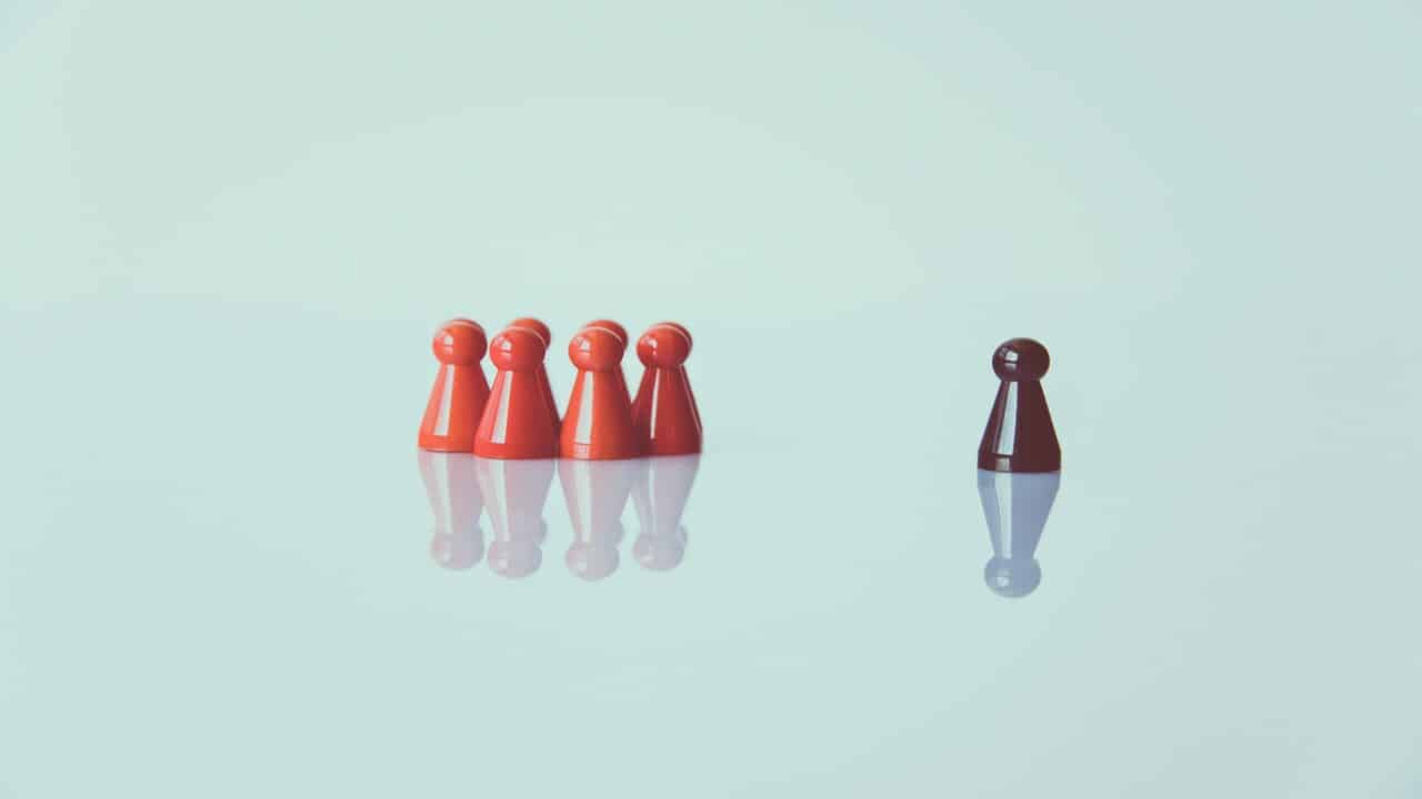 Game pieces depicting a leader and followers.