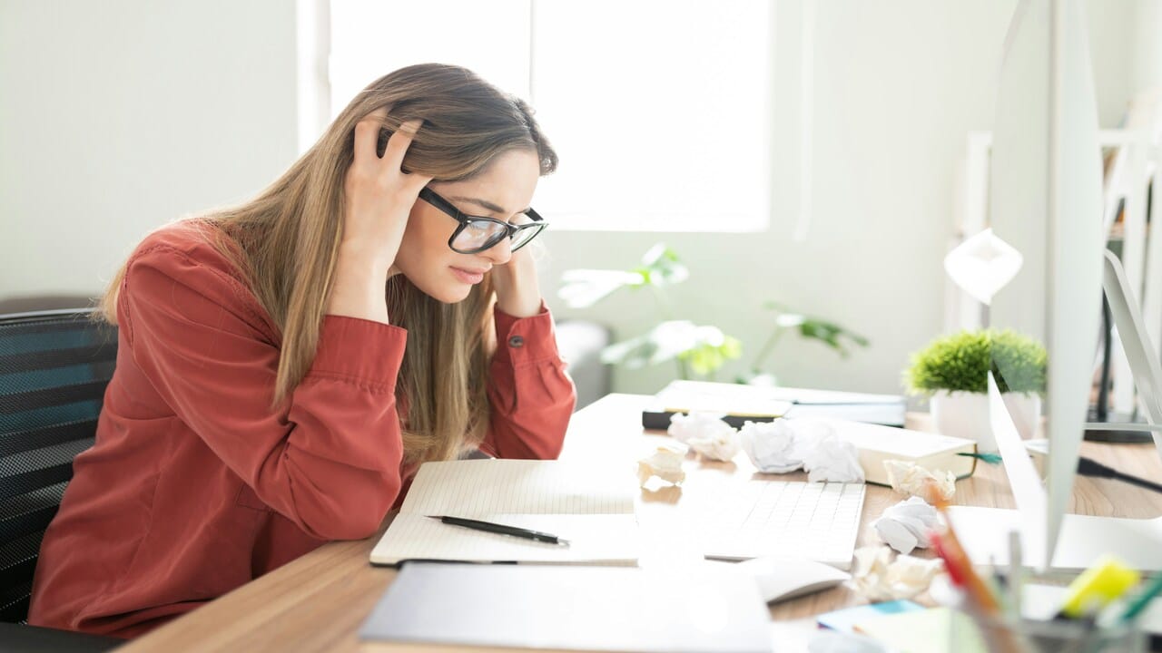 A woman stressed at work.