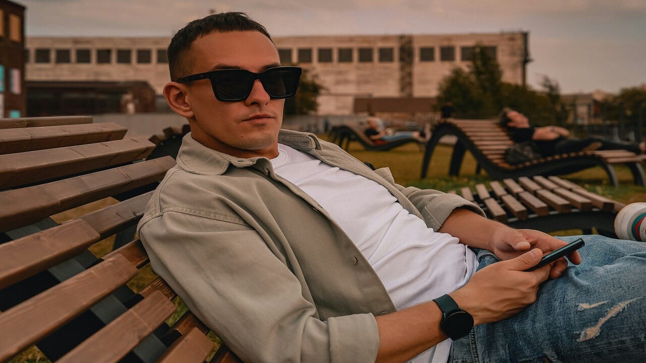A man with sunglasses looking at the camera.