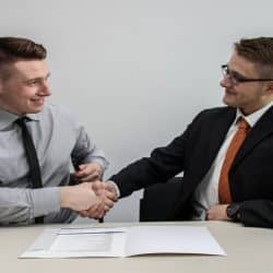Two men shaking hands.