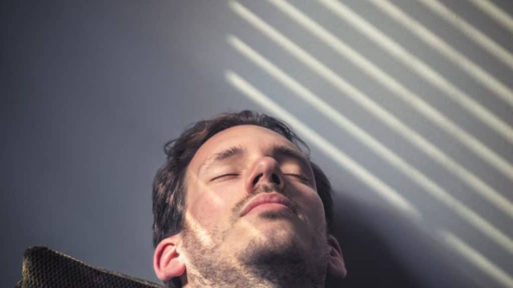 Man practicing mindfulness to calm himself before a conversation.