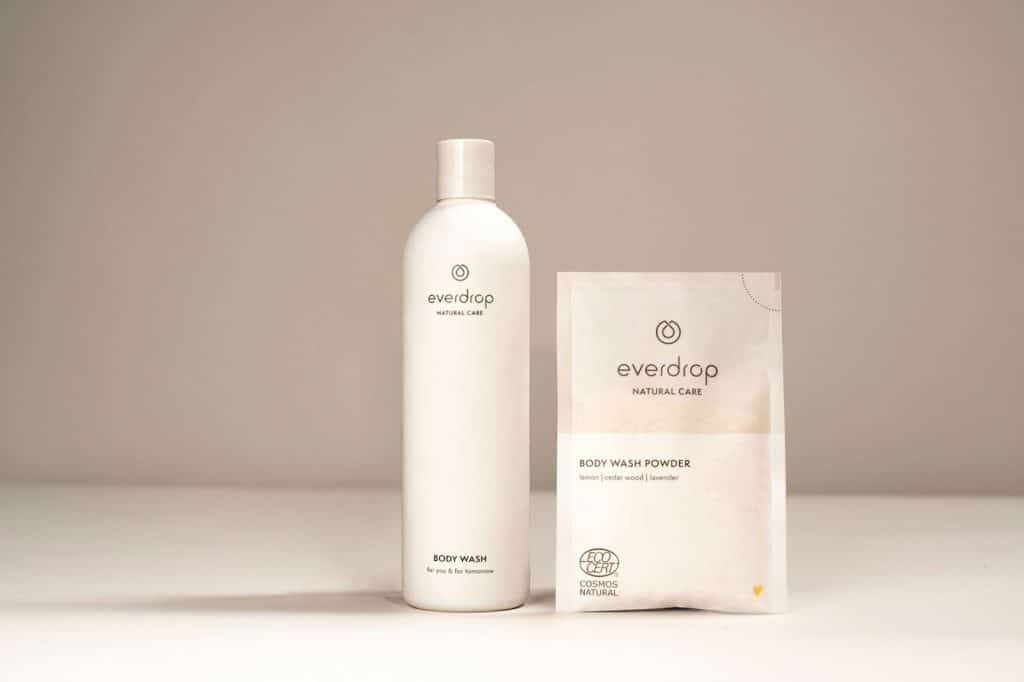 A mocked-up body wash liquid and powder.