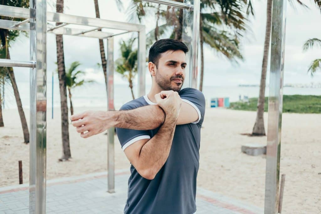 A man stretching his muscle.