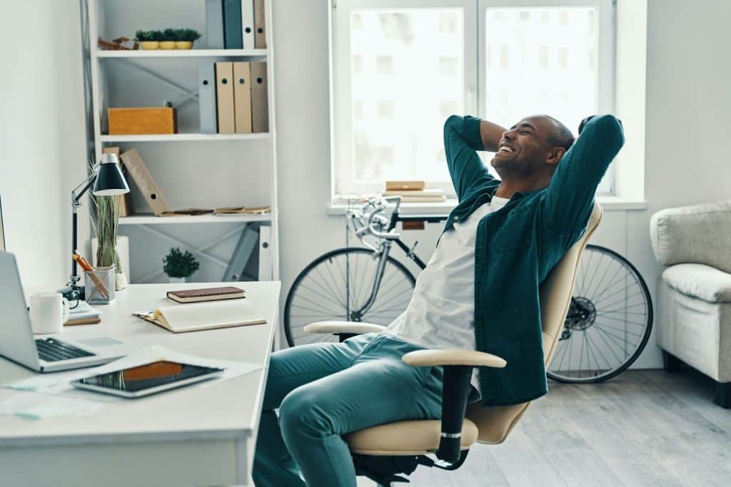 A man leaning on his chair