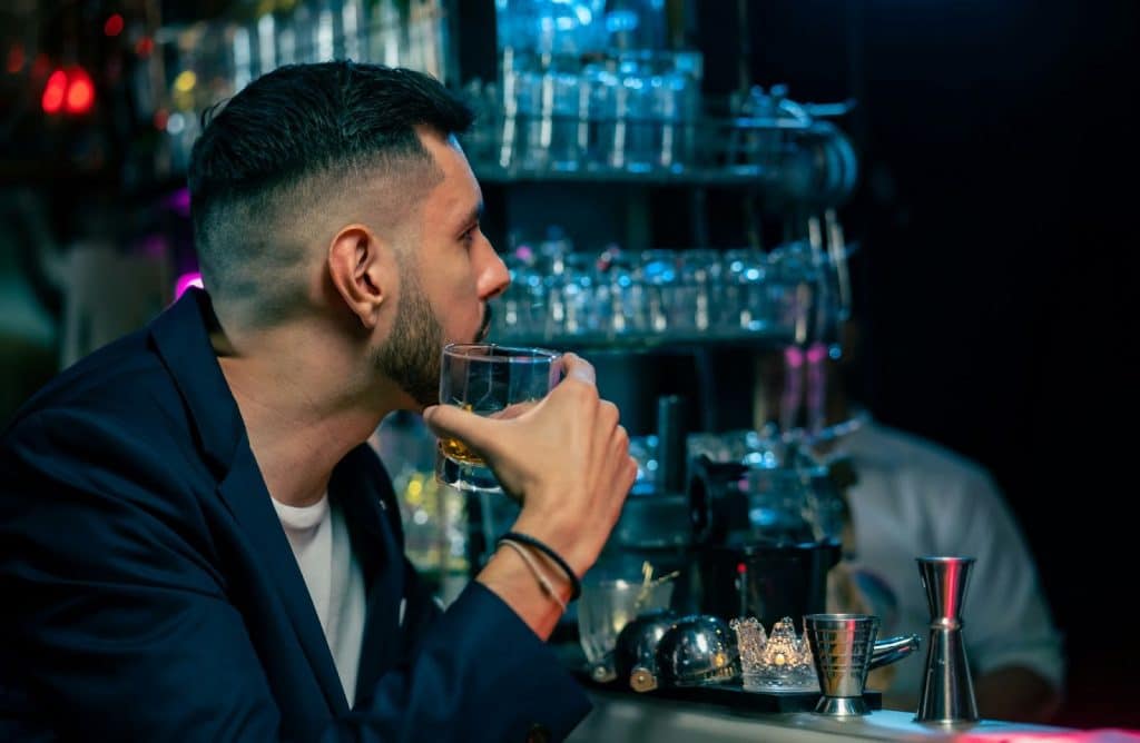 A man drinking alcohol.