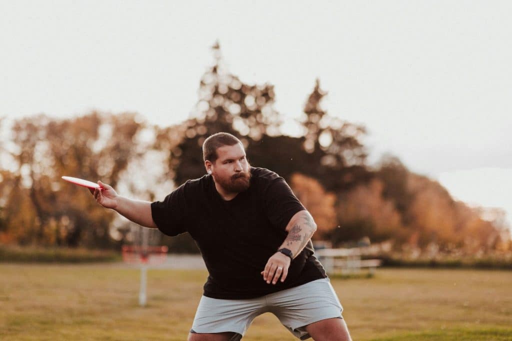 A man throwing a frisbee.