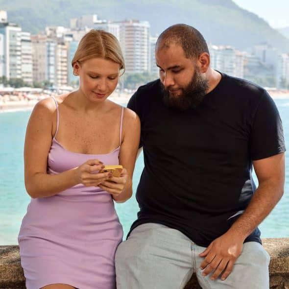 A man and woman sitting.