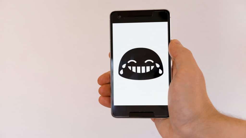 A laughing emoji on a smart phone