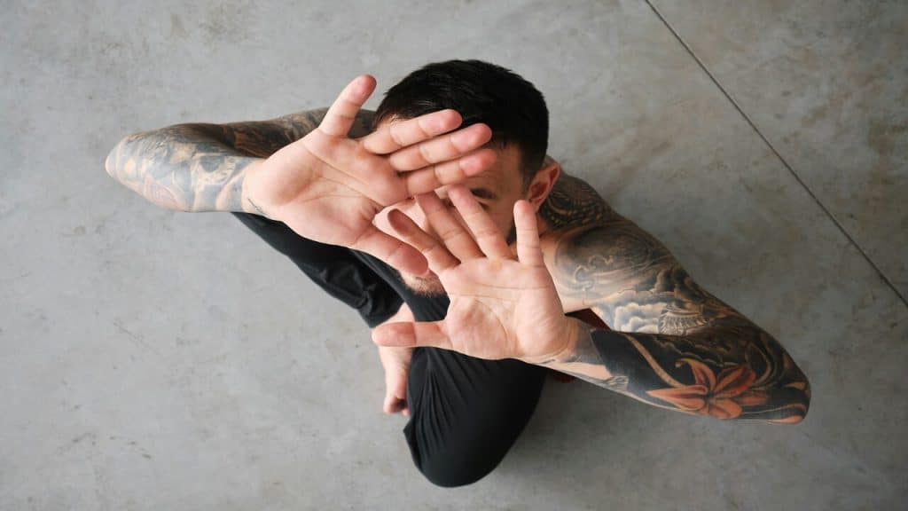A man hiding his face