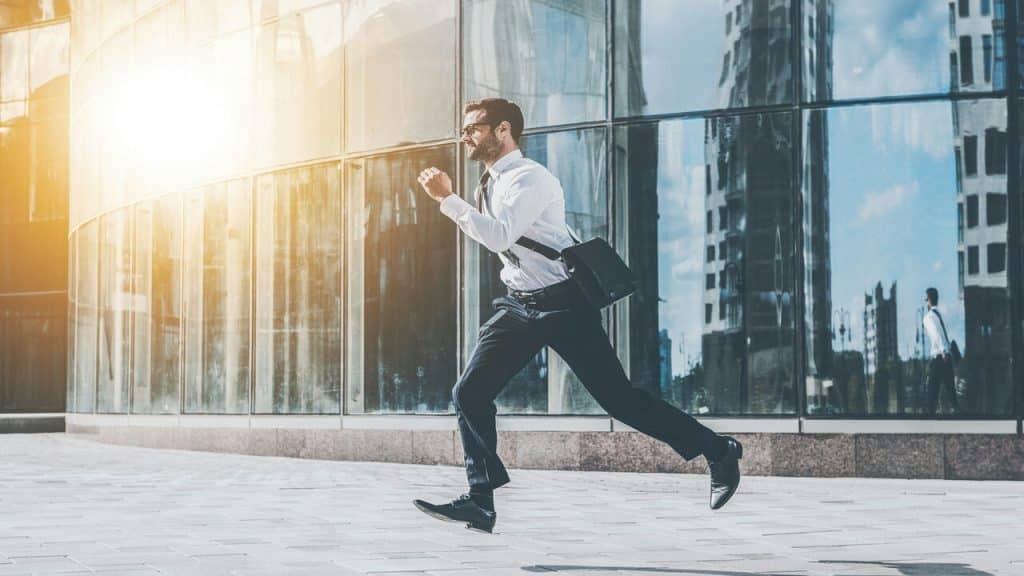 A person running in business casual