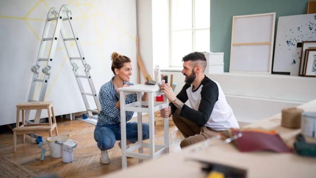 Couple renovating furniture and supporting each other’s passions in a collaborative atmosphere