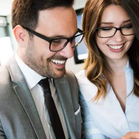 Man and woman working, both expressing confidence and balance
