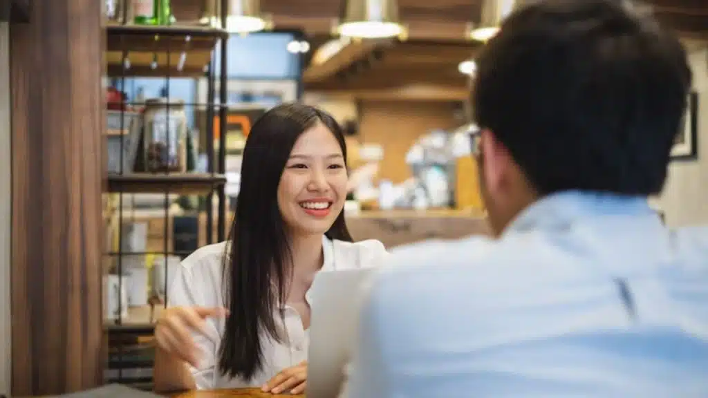 Woman confidently leading a conversation at a date table