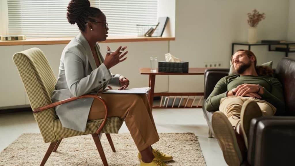 Man having a one on one conversation with a therapist.