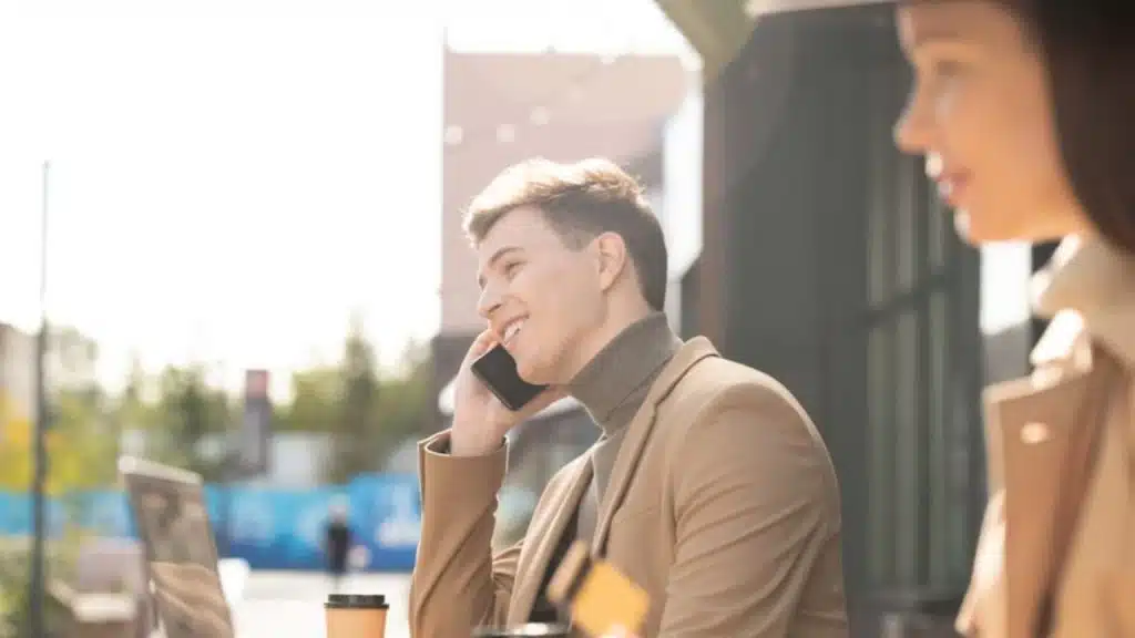 Man taking a call while on date.