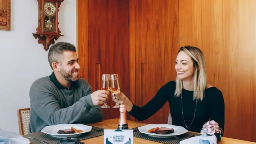 Couple celebrating a shared success at home.