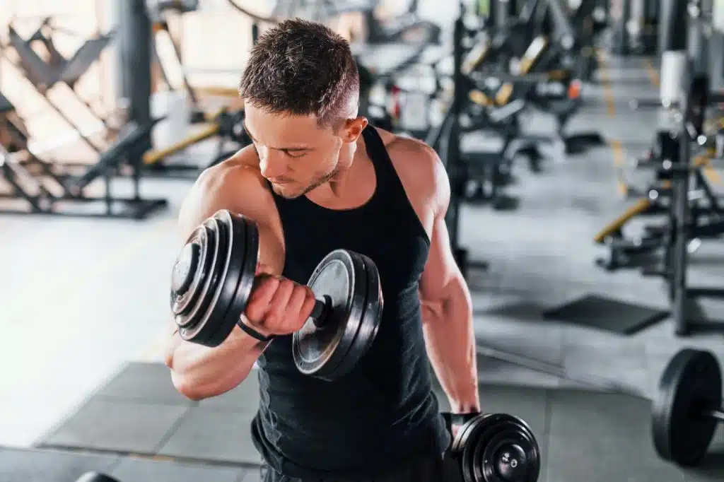 A picture of a man lifting a barbell.