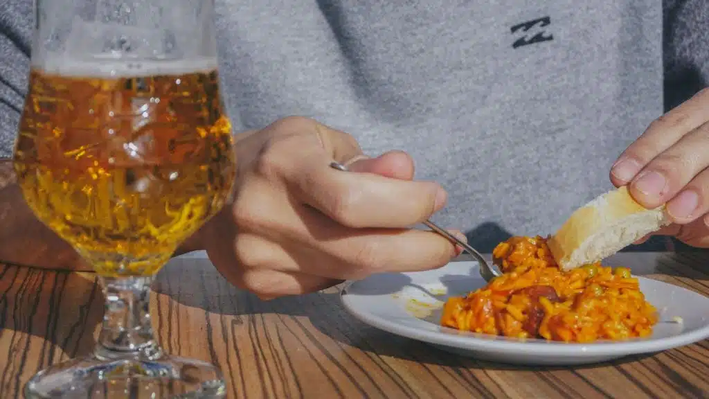 A person eating a bread.